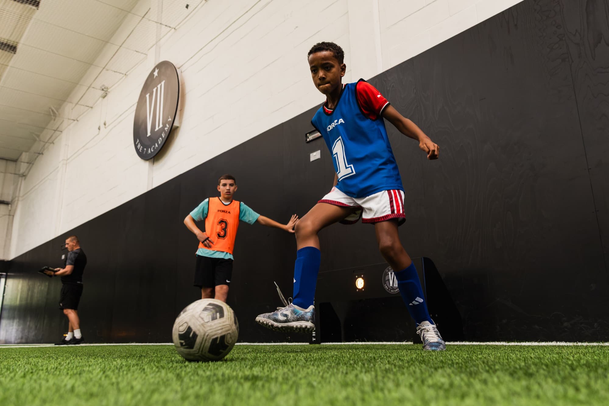Players training in front of the goal at The 7 Academy